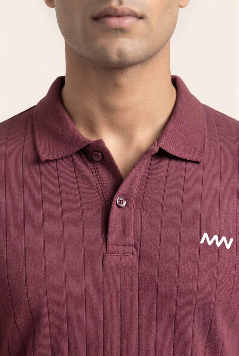 Maroon ribbed polo shirt with white logo, premium men's fashion for sharp fits and modern style.