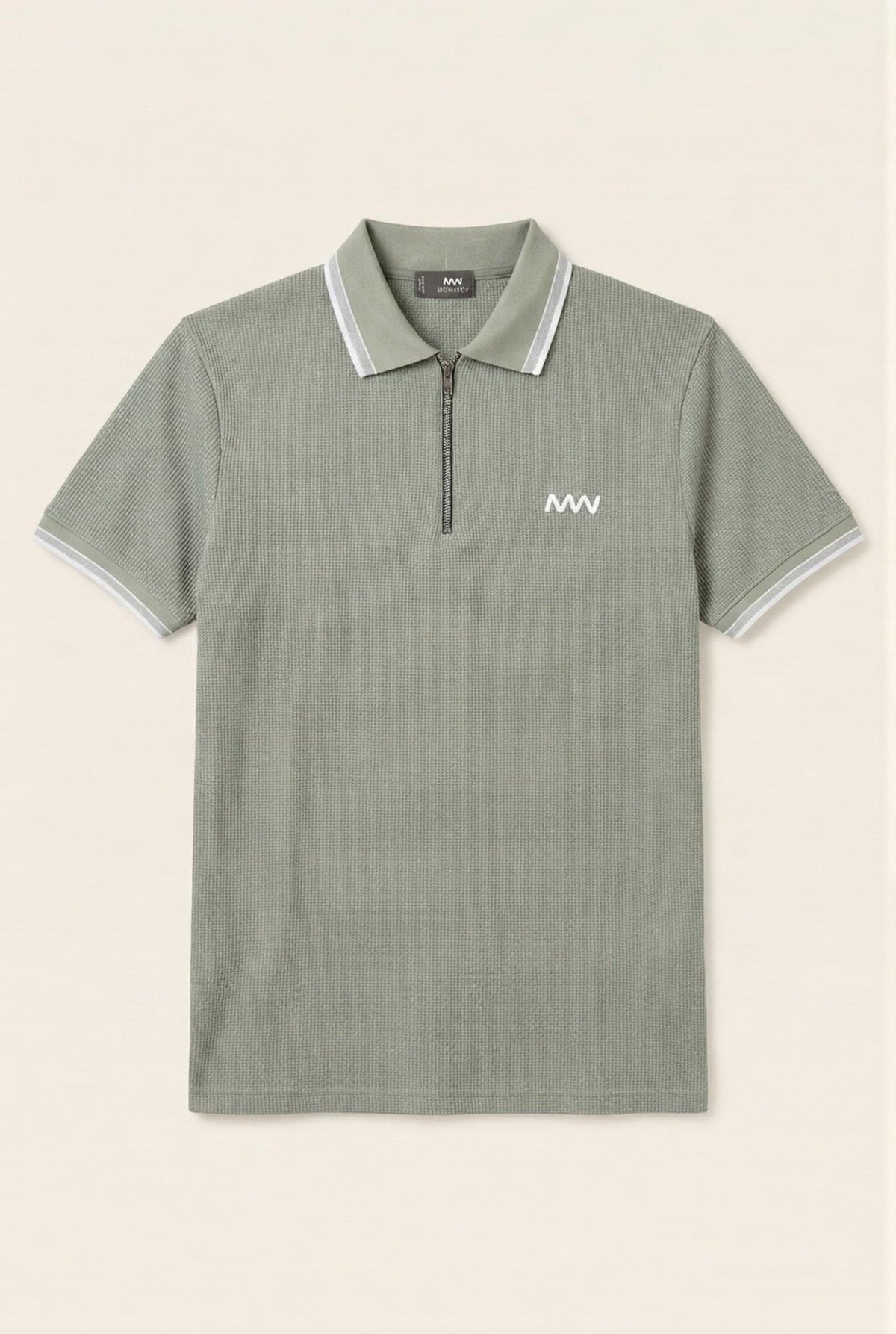 Olive green men's polo shirt with white trim and half-zip, featuring textured fabric and chest logo