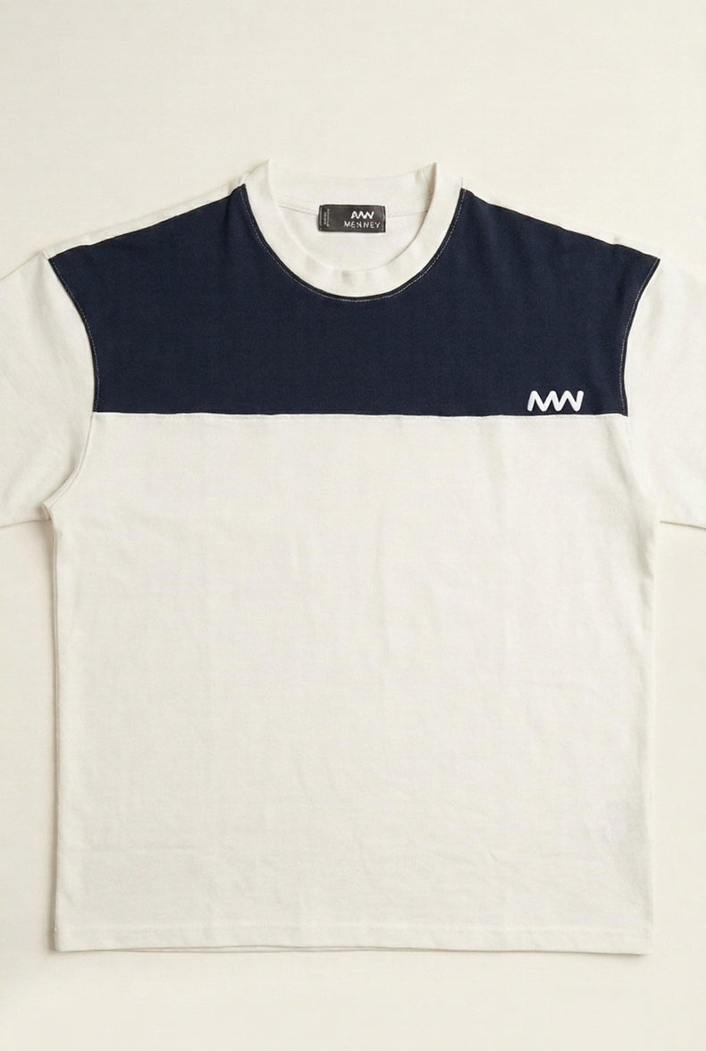 Men's color-block t-shirt with navy and cream panels, modern logo detail, premium cotton fit