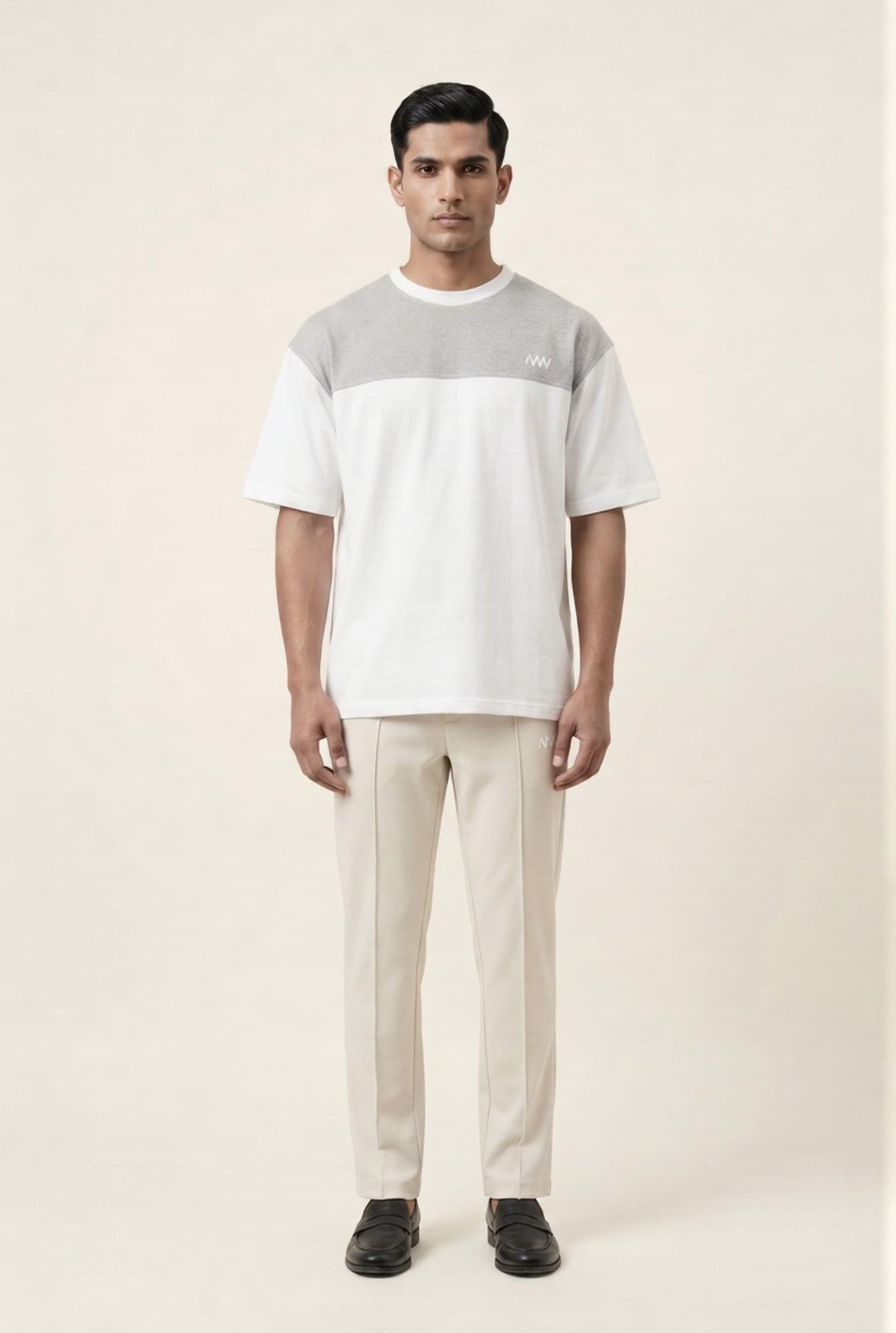 Men's modern color-block t-shirt with beige trousers, premium casual wear for sharp, stylish looks