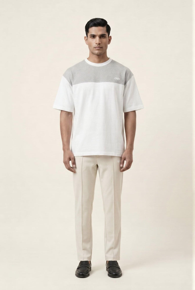 Men's modern color-block t-shirt with beige trousers, premium casual wear for sharp, stylish looks