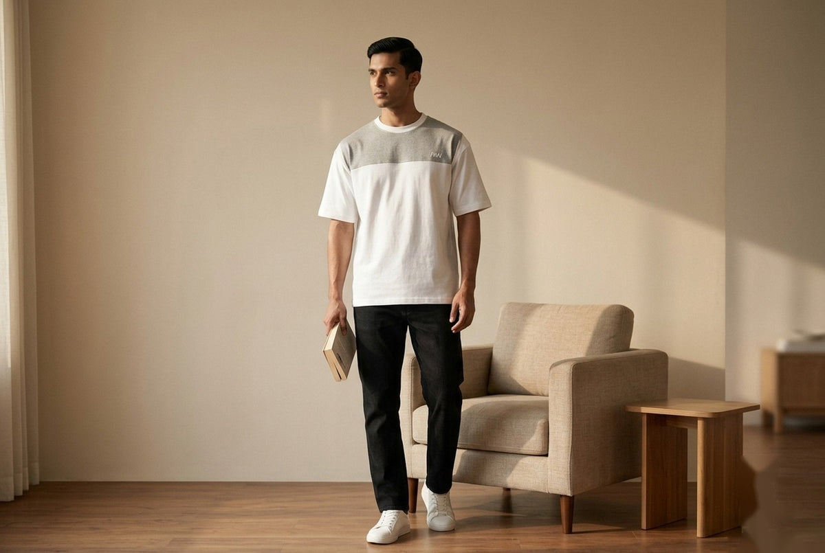 MENWEY White/Grey Panel Drop Shoulder T-Shirt — model standing by armchair, holding a book